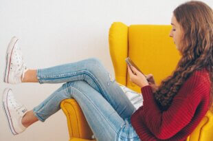 woman answering surveys on smartphone